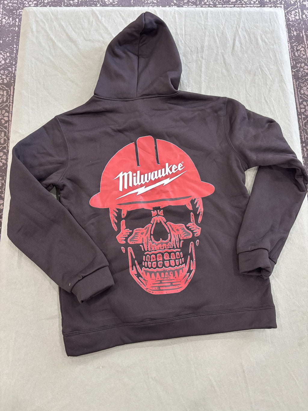 Milwaukee Black Hoodie with Red Logo and Skull Design